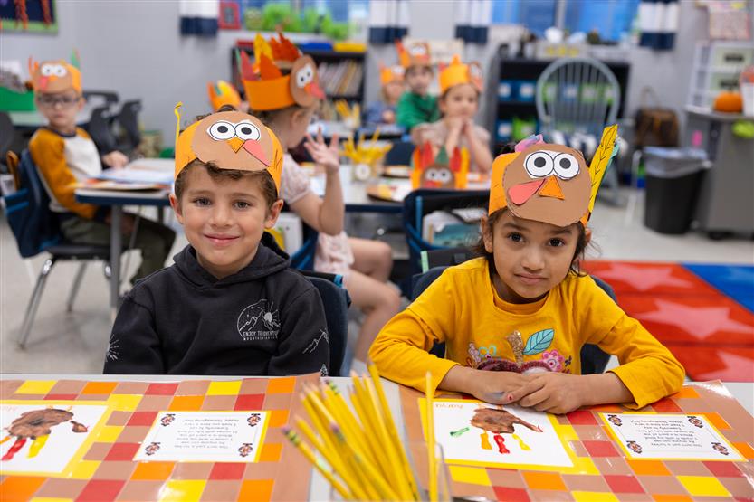 Creekside kindergartners and their families enjoy breakfast